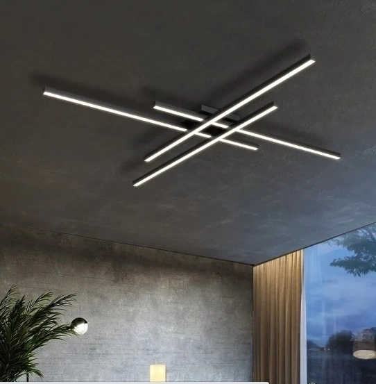 Luminária moderna com barras cruzadas no teto.